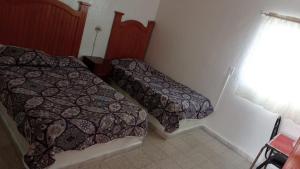 Postel nebo postele na pokoji v ubytování Hotel Rocio
