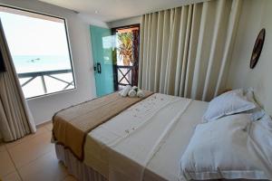 Pousada Grandmar, Maragogi客房内的一张或多张床位