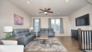 a living room with a couch and a ceiling fan at 802 Dye Townhouse home in North Myrtle Beach