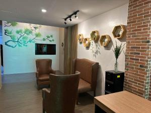 TV a/nebo společenská místnost v ubytování Aden Hotel