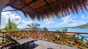 a balcony of a resort with a view of the ocean at Sunset Lane in Laborie