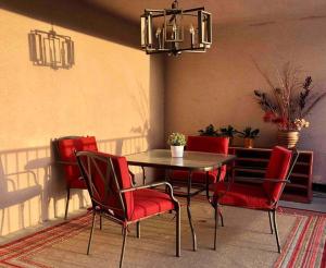 a dining room with a table and red chairs at Silverlake and Echo Park - 6min to Downtown and Hollywood - in Los Angeles