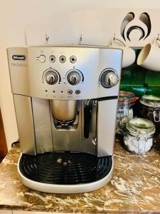 a coffee maker is sitting on a counter at Cosy Cottage in Central Reading Free Parking & Fast Wifi in Reading