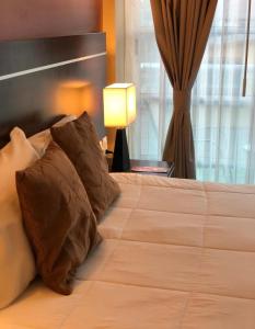 Postel nebo postele na pokoji v ubytování Ivissa Hotel