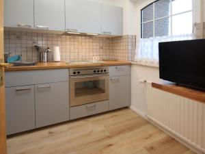 Kuchyň nebo kuchyňský kout v ubytování Holiday home in Dornumergrode