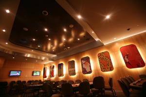 a conference room with tables and chairs in it at Fun City Resort Hotel in Burlington
