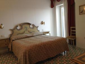 Posteľ alebo postele v izbe v ubytovaní Hotel Lidomare