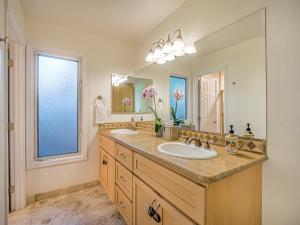 a bathroom with a sink and a large mirror at Amazing Santa Cruz Landscaped Paradise in Santa Cruz