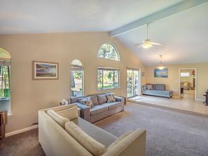 a living room with a couch and a ceiling fan at Amazing Santa Cruz Landscaped Paradise in Santa Cruz