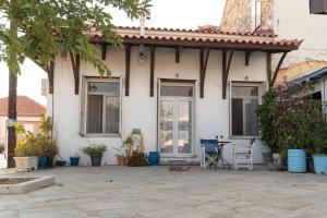 a house with a patio in front of it at Dimizis in Methoni