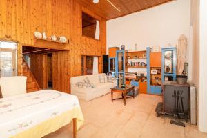 a living room with a bed and a stove at Dimizis in Methoni