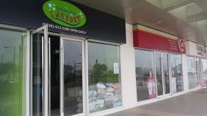 a store front with glass doors and a sign at Tagaytay Nordic Nest Staycation at Wind Residences with Netflix Wifi near Sky Ranch in Tagaytay