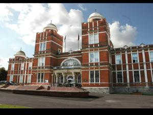 a large brick building with two domes on top of it at Hidden Treasure-Netflix and Wi-Fi in Gillingham
