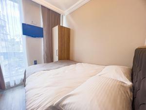 Ein Bett oder Betten in einem Zimmer der Unterkunft Helen Inn