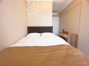Ein Bett oder Betten in einem Zimmer der Unterkunft Helen Inn