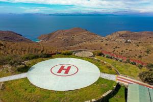 an overhead view of a circle with the h logo on it at Green Island Resort Villas Athena and Poseidon in Ioulis