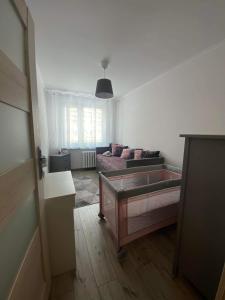 Posteľ alebo postele v izbe v ubytovaní Apartament Górska Panorama