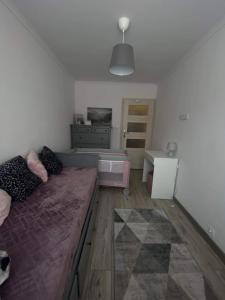 Łóżko lub łóżka w pokoju w obiekcie Apartament Górska Panorama