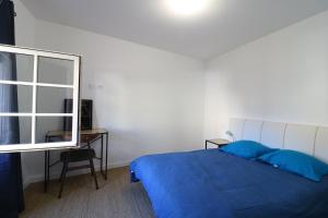 Postel nebo postele na pokoji v ubytování Gîte de charme du Puy