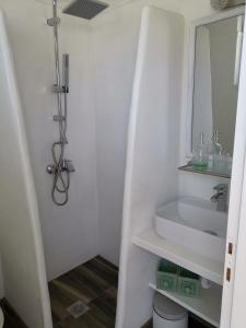 a bathroom with a sink and a mirror at Villa Rizia in Kolimbia