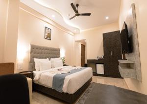 Voodi või voodid majutusasutuse The Verda De Miranda Resort Morjim North Goa toas