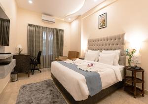 Voodi või voodid majutusasutuse The Verda De Miranda Resort Morjim North Goa toas