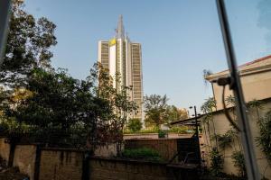 a view of a tall building in the distance at The Hillpoint Nest in Nairobi