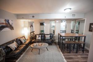 a living room with a couch and a table at Stay Together Suites in Las Vegas