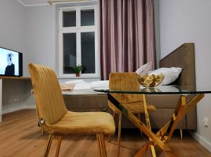 Televízia a/alebo spoločenská miestnosť v ubytovaní Hugo Star Apartments