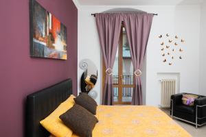 A bed or beds in a room at Suite Gaia