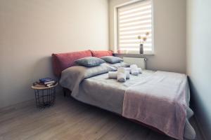 Posteľ alebo postele v izbe v ubytovaní Apartament w Kamienicy na Kłodzkiej