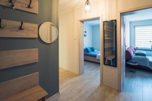 Posteľ alebo postele v izbe v ubytovaní Apartament w Kamienicy na Kłodzkiej