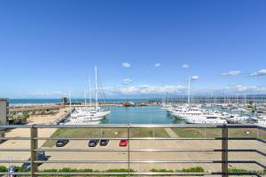 a view of a marina with boats in the water at L'incanto Di Boccadarno in Marina di Pisa