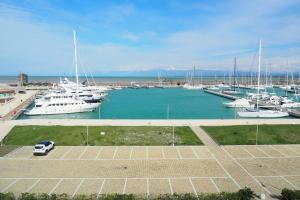 a bunch of boats parked in a marina at L'incanto Di Boccadarno in Marina di Pisa