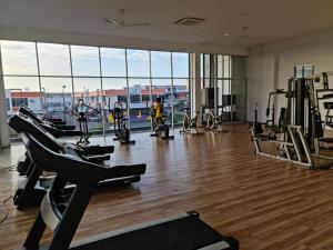 a gym with treadmills and exercise equipment in a building at RHR Deluxe GuestHouse Kinarut Papar Sabah - Pool View in Papar