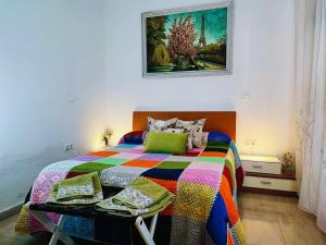 A bed or beds in a room at Apartamento La flor de Mayo