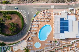 an overhead view of a resort with a pool at Hotel Altamadores in Puerto Rico de Gran Canaria