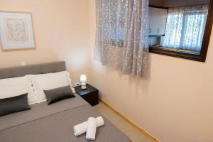 A bed or beds in a room at Villa Red Porto Cheli
