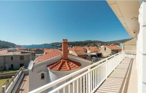 a view of a city from the balcony of a building at Sunset Vela Luka in Vela Luka