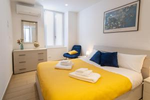 Postel nebo postele na pokoji v ubytování Casa vacanza Valentina - Downtown Bergamo