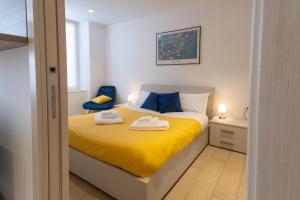 Postel nebo postele na pokoji v ubytování Casa vacanza Valentina - Downtown Bergamo