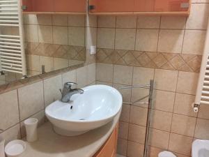 a bathroom with a sink and a mirror at IL Quieto Uliveto in Ostuni +50 photos
