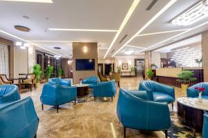 Posezení v ubytování Al Ertiqaa Hotel