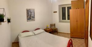 Posteľ alebo postele v izbe v ubytovaní Appartamento al centro di Ustica