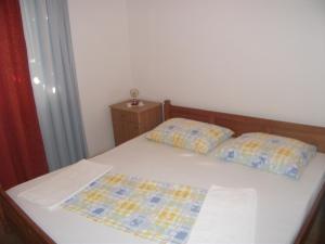 Łóżko lub łóżka w pokoju w obiekcie House Lumbarda (876)