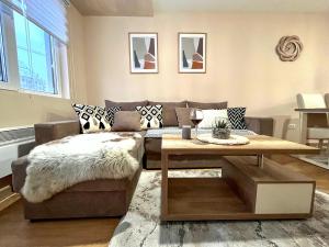 a living room with a couch and a table at Borski Luxury Apartments in Zlatibor