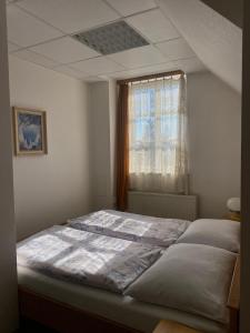 Кровать или кровати в номере Apartmán Vrchlabí