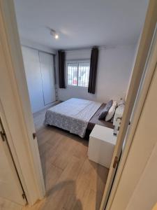 Posteľ alebo postele v izbe v ubytovaní Apartment Torremolinos