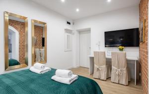 Łóżko lub łóżka w pokoju w obiekcie Apartamenty KB Toruń
