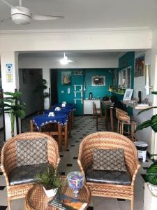 a dining room with tables and chairs in a restaurant at Pousada Mar Aberto in Salvador